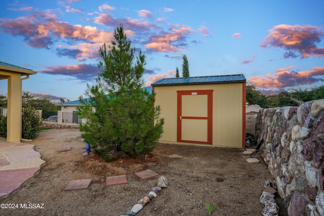 view of outdoor structure at dusk