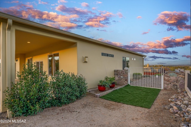 view of property exterior at dusk