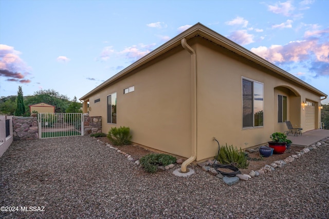 view of property exterior at dusk