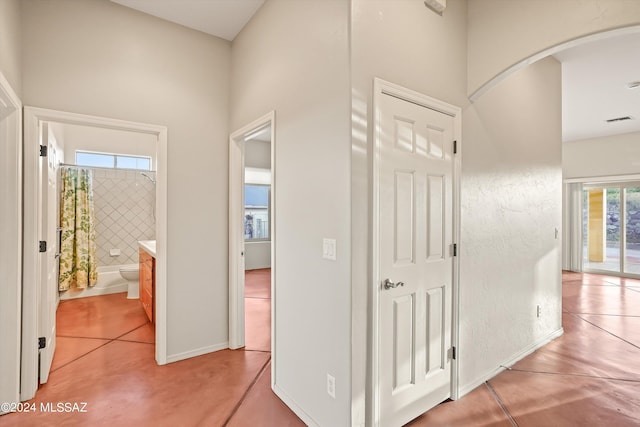 hallway featuring a healthy amount of sunlight