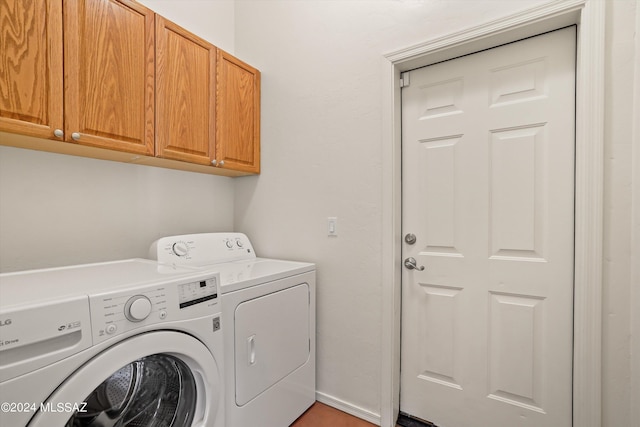 washroom with cabinets and independent washer and dryer