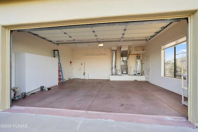 garage with heating unit and water heater