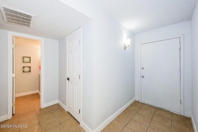 full bathroom featuring tile patterned floors, vanity, toilet, and shower / tub combo