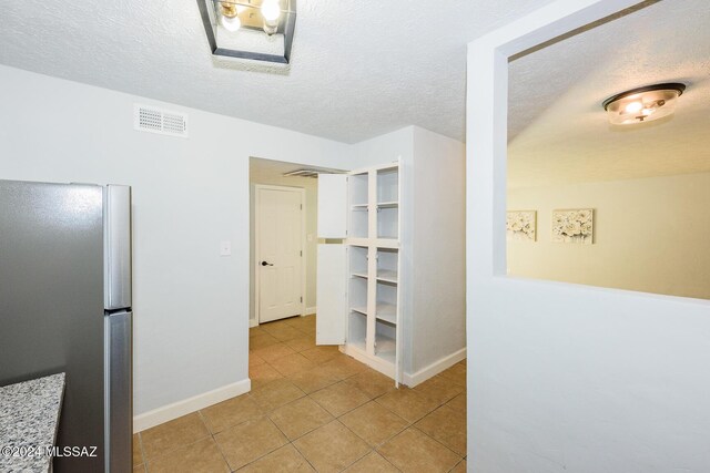 entrance foyer featuring light tile patterned flooring