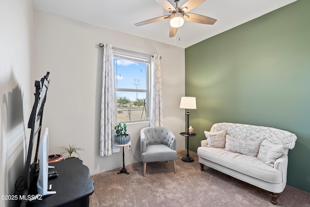 sitting room with carpet flooring and ceiling fan