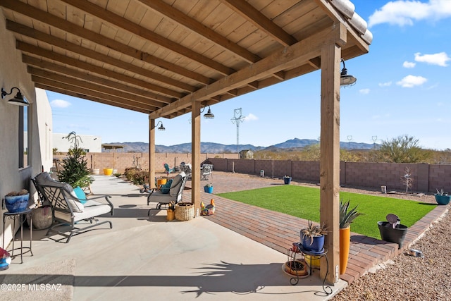 view of patio / terrace featuring a mountain view