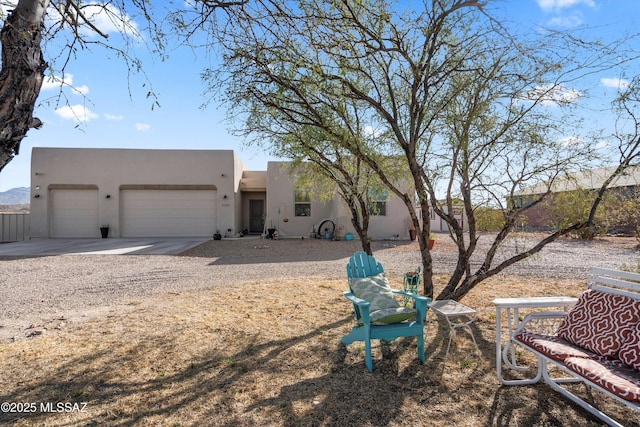 back of house featuring a garage