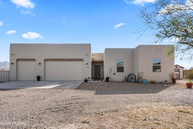 southwest-style home with a garage