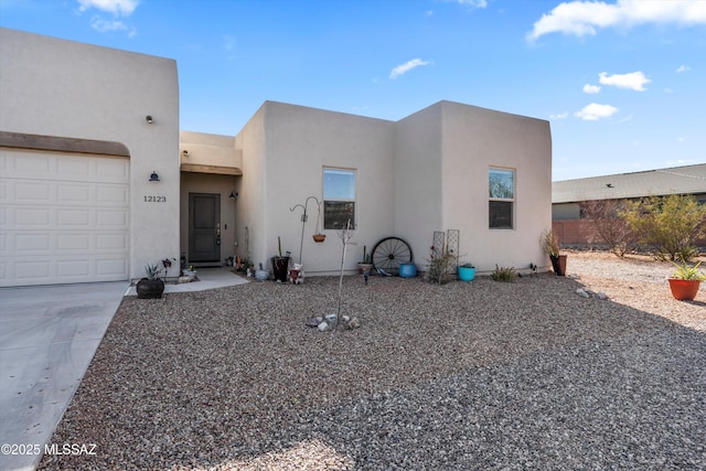 southwest-style home with a garage