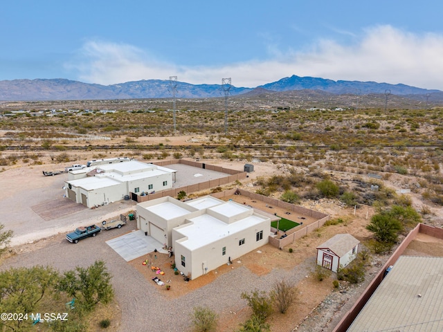 birds eye view of property featuring a mountain view