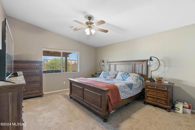 carpeted bedroom with ceiling fan and lofted ceiling