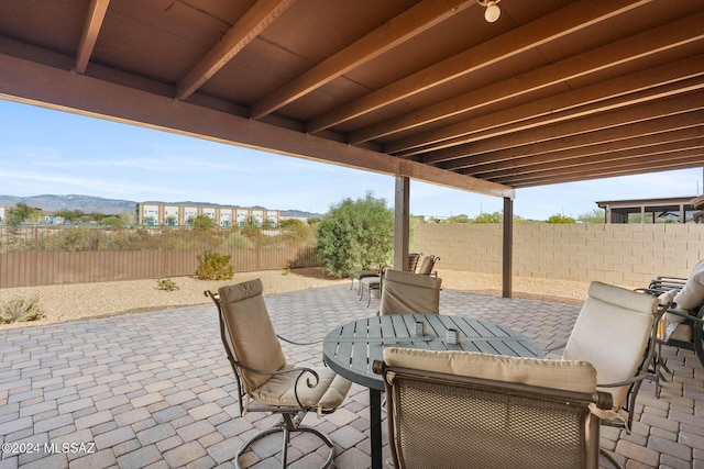 view of patio / terrace with a mountain view