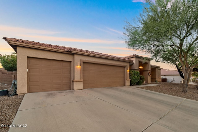 view of front of property with a garage