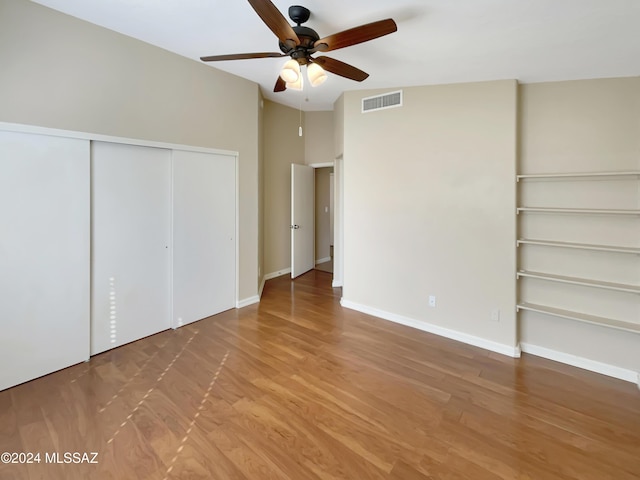 unfurnished bedroom featuring ceiling fan and hardwood / wood-style floors