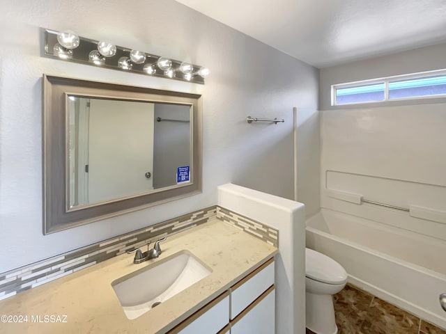 full bathroom featuring shower / bath combination, vanity, tasteful backsplash, and toilet