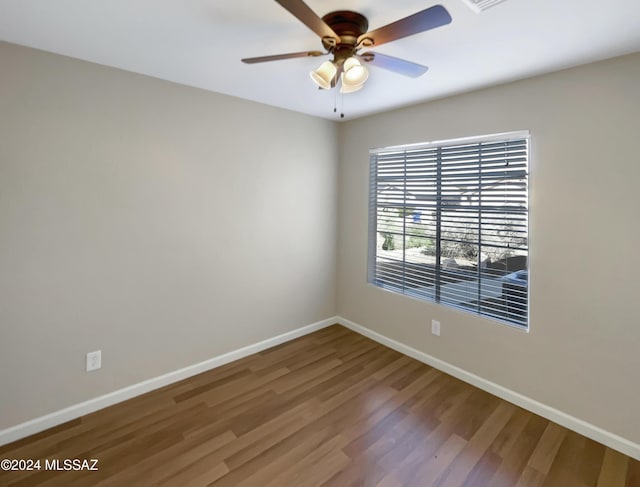 unfurnished room with ceiling fan and wood-type flooring