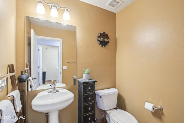 bathroom featuring sink and toilet