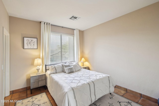 bedroom with tile patterned floors