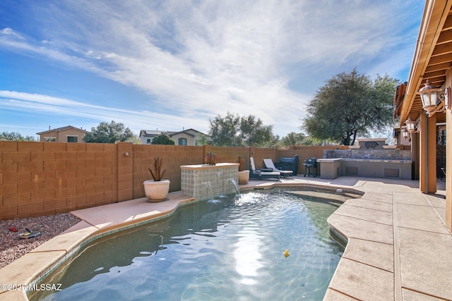 view of pool featuring pool water feature and a patio area