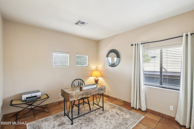 office area featuring light tile patterned flooring