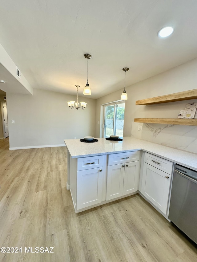 kitchen with dishwasher, white cabinets, and pendant lighting