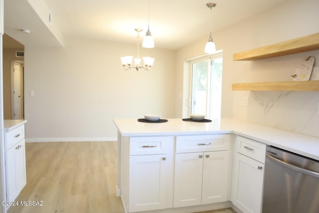 kitchen featuring kitchen peninsula, hanging light fixtures, stainless steel dishwasher, light hardwood / wood-style floors, and white cabinetry