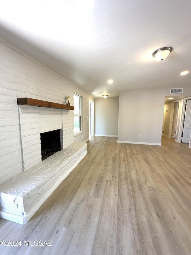 unfurnished living room featuring light wood-type flooring