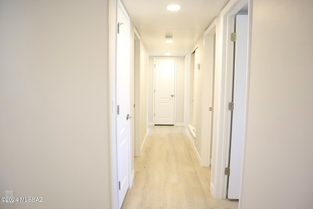 hallway with light wood-type flooring