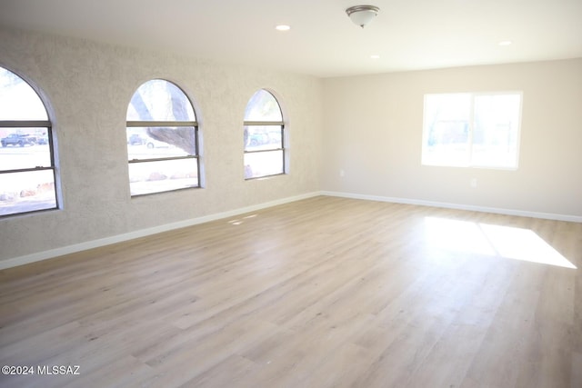 unfurnished room featuring light wood-type flooring