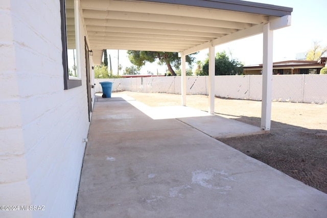 view of patio / terrace featuring a carport