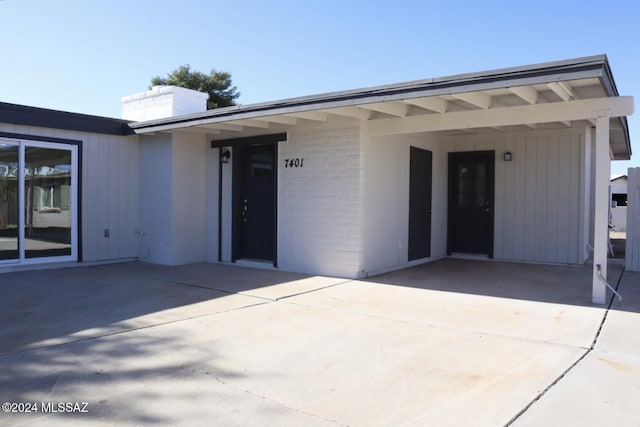 entrance to property with a patio area