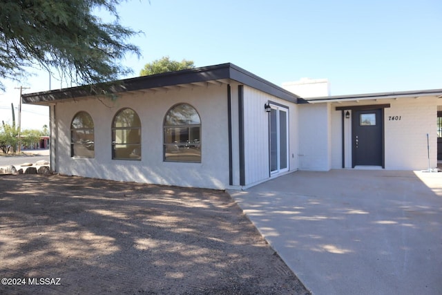 view of home's exterior with a patio area