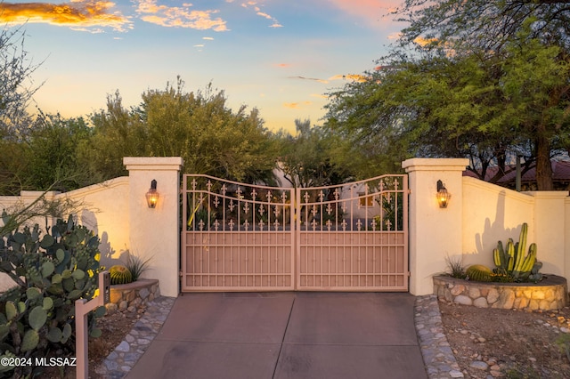 view of gate at dusk