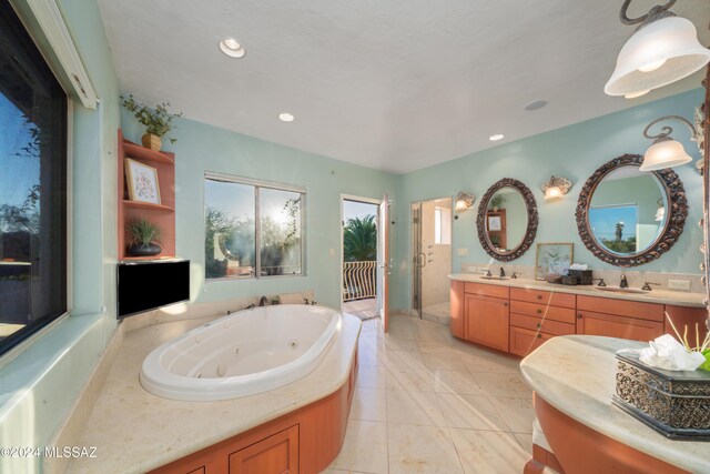 bathroom featuring plus walk in shower and vanity