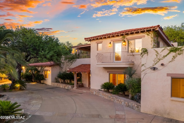 5970 N Genematas Dr, Tucson, AZ 85704 - mediterranean / spanish-style house featuring a tiled roof, stucco siding, and a balcony