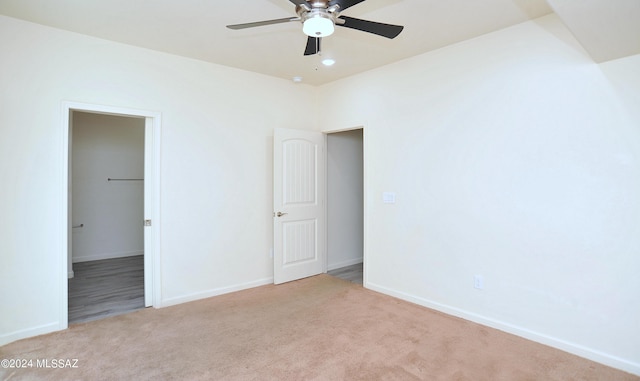 empty room with light carpet and ceiling fan