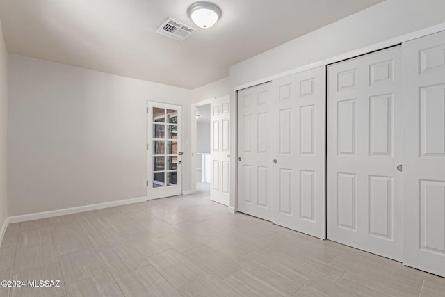 unfurnished bedroom featuring a closet