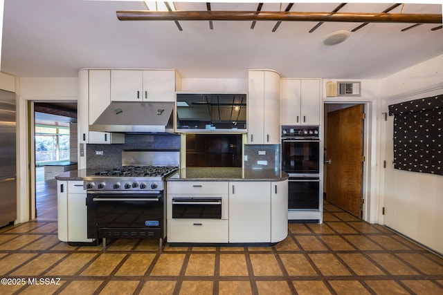 kitchen with stainless steel appliances, decorative backsplash, and white cabinets