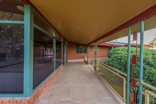 view of patio featuring a balcony