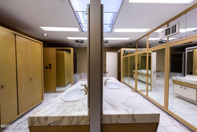 interior space featuring a skylight and sink