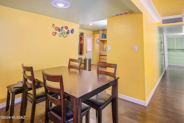 dining room featuring wood-type flooring