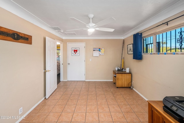 entrance foyer featuring light tile patterned floors and ceiling fan