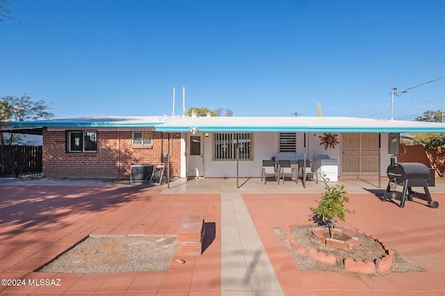 back of house featuring a patio and central air condition unit