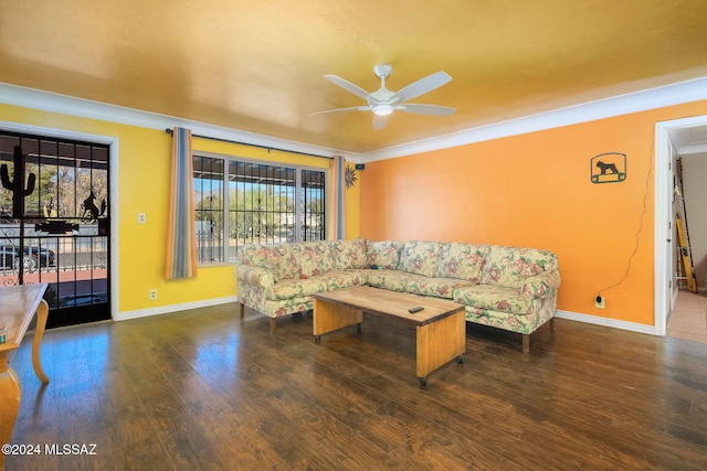 living room with dark hardwood / wood-style flooring, plenty of natural light, ornamental molding, and ceiling fan