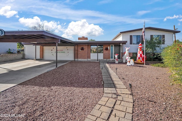 view of front of house featuring a garage and a carport