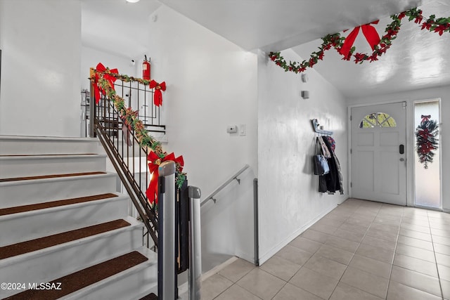 foyer featuring light tile patterned floors