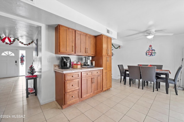 kitchen with ceiling fan and light tile patterned floors