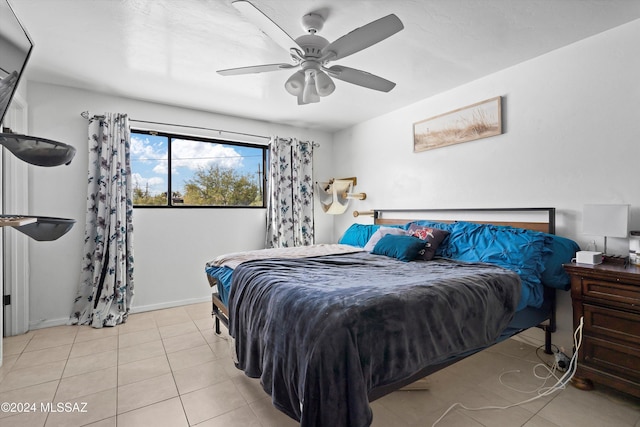 bedroom with light tile patterned floors and ceiling fan