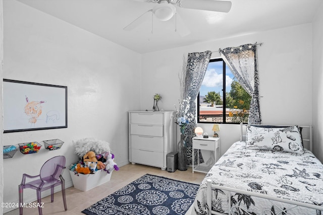 bedroom featuring light tile patterned floors and ceiling fan