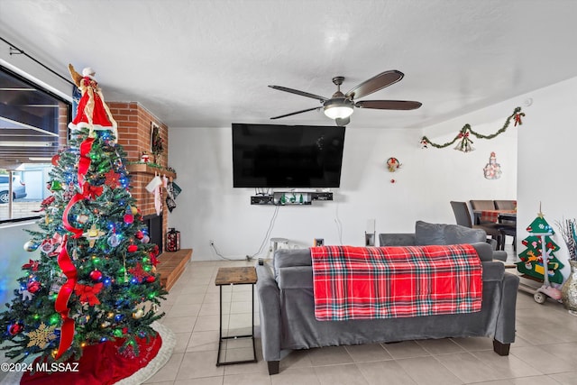 bedroom with a textured ceiling, tile patterned floors, and ceiling fan